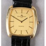 A BAUME AND MERCIER GENTLEMAN'S QUARTZ DRESS WRISTWATCH in 18ct gold tonneau case No 1136929