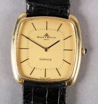 A BAUME AND MERCIER GENTLEMAN'S QUARTZ DRESS WRISTWATCH in 18ct gold tonneau case No 1136929