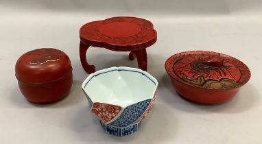 A Japanese cinnabar coloured dish and cover moulded as a flower head, 13.5cm diameter together
