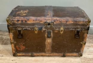 A 19th century canvas and leather studded trim, brass mounted trunk having a slight domed top and