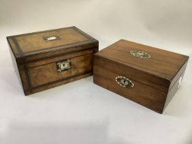 A Victorian figured walnut and ebony banded work box inlaid with a mother-of-pearl cartouche and