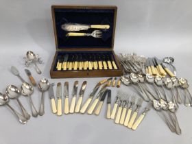 An oak canteen of silver plated fish knives and forks with fish servers together with a further