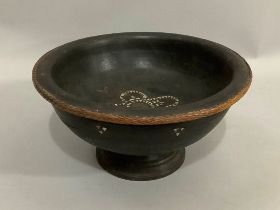 An ebonised turned bowl with applied woven straw rim, inlaid in mother-of-pearl and Chinese coin