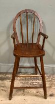 A stained beech child's stick back high chair