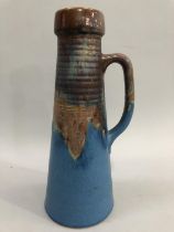Bourne Denby studio pottery jug of conical form, having a rust and powder blue glaze, signed to