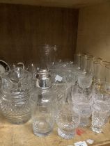 A quantity of glassware comprising hobnail cut glass jug, six gilt wines, etched glassware , etc.