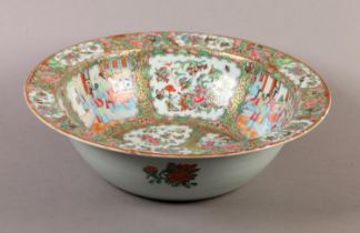 A CHINESE FAMILLE ROSE PUNCH BOWL, 19th century, painted with figures on a terrace and with peony,