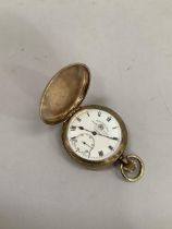 An early 20th century pocket watch by Thomas Russell and Sons Liverpool in a rolled gold hunting