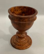 A burr walnut turned goblet on stepped circular base 18.5cm