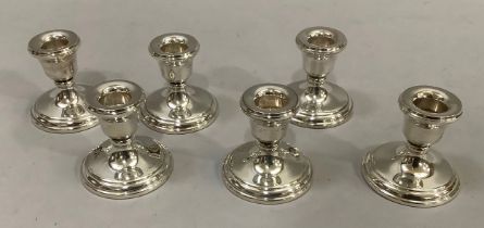 A set of six silver short candlesticks of circular outline, 6.25cm, Birmingham 1990