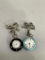 An early 20th century silver and enamel fob watch and matching ribbon tied bar brooch blue and