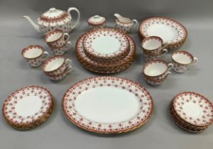 A Spode china fleur-de-lys tea and dinner service comprising teapot, lidded sugar and milk jug,