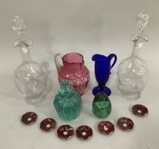 19th century glassware comprising two decanters with frilled rims, cranberry jug with white