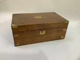 A Victorian oak brass bound writing slope with leather incised surface and compartments 41.5cm x