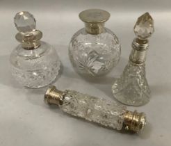 A silver collared and cut glass globular scent bottle, Birmingham 1914, 11.5cm high together with