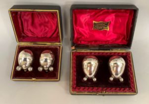 A boxed pair of Victorian silver pepper pots Birmingham 1891 for Hilliard and Thomson each of oval