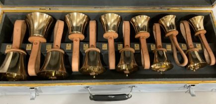 Set of twelve musical handbells in fitted case with leather straps
