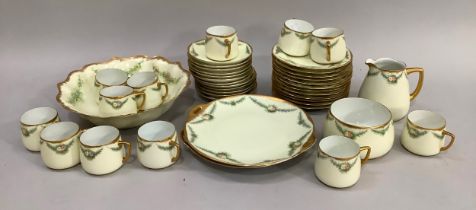 A Silesia hand painted tea service, the cream ground edged in gilt and delicately painted with