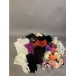 A selection of floral corsages, and a feather, (15) in all colours, together with a varied
