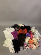 A selection of floral corsages, and a feather, (15) in all colours, together with a varied