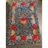 A colourful rag rug, 20th century, of unusually large dimensions, designed with central, overlapping
