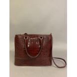 MaxMara: a burgundy skin effect leather bag with shoulder strap and two side handles, solid box