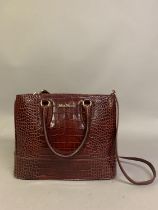 MaxMara: a burgundy skin effect leather bag with shoulder strap and two side handles, solid box