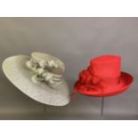 Cosmo Jenks asymmetrical red straw hat with organza rose detail to the grosgrain ribbon, contained