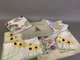 1930’s and earlier hand-embroidered linens, some stylized, some quite unusual: a tablecloth worked