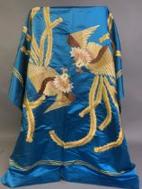A large 20th century Chinese coverlet, turquoise silk satin embroidered in silks and gold thread