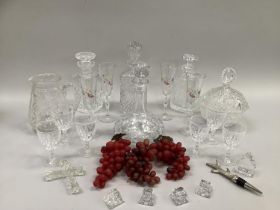 Quantity of cut glass including four decanters, a jug, a bowl and cover, wine glasses etc