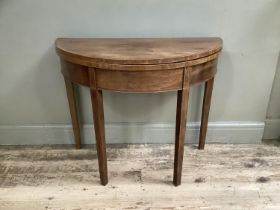 An Edwardian mahogany and satinwood banded demi-lune tea table on sqaure legs, 91cm x 91cm