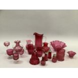 Quantity of 19th and 20th century cranberry glass including large fluted jug, cruet set, two small