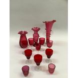 Quantity of 19th century and later cranberry glass including vase with flared rim etc