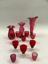 Quantity of 19th century and later cranberry glass including vase with flared rim etc