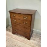 An early 20th century bow fronted mahogany chest of four long drawers by Hampton's of London, 77cm x