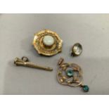 A Victorian opal shield brooch in 9ct. A/F, the circular facetted stone claw set to the centre,