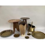 Two Middle Eastern carved tables, two Middle Eastern etched and moulded brass trays, brass coal