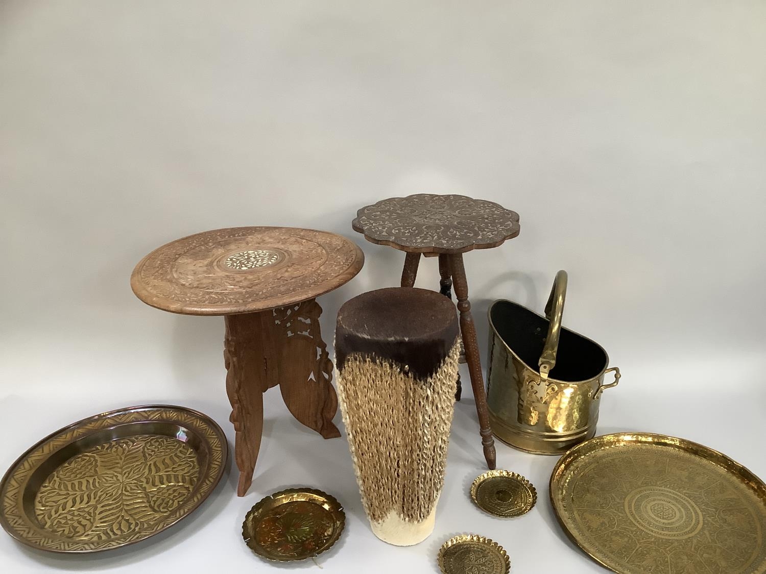Two Middle Eastern carved tables, two Middle Eastern etched and moulded brass trays, brass coal - Image 2 of 2