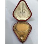 A Victorian heart-shaped 9ct. gold back and front locker hung on a Victorian 9ct. gold fox tail link
