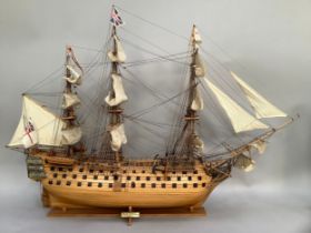 A scale model of HMS Victory by Historic Marine, on display stand, 105cm x together with a cross