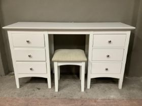 A white twin pedestal dressing table having six short drawers, on square feet together with stool,