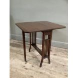 An Edwardian mahogany Sutherland table with drop leaves