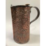 A copper secessionist style lidded jug, the body moulded in heavy relief with trailing foliage and a