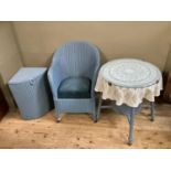 A Lloyd Loom style blue wicker painted chair together with a glass topped table