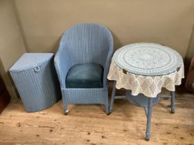 A Lloyd Loom style blue wicker painted chair together with a glass topped table