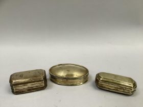 Three 18th century brass tobacco tins, two having rubbed embossed scenes, one bearing traces of