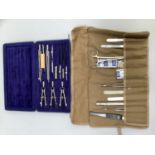 Simplon compass drawing set together with a scalpel set in a roll