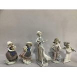 Five Lladro figures comprising, girl with goose, cherub with flute, girl with sparrow, two girls