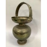 20th century Indian engraved kamandalu brass holy water carrier, 59cm high